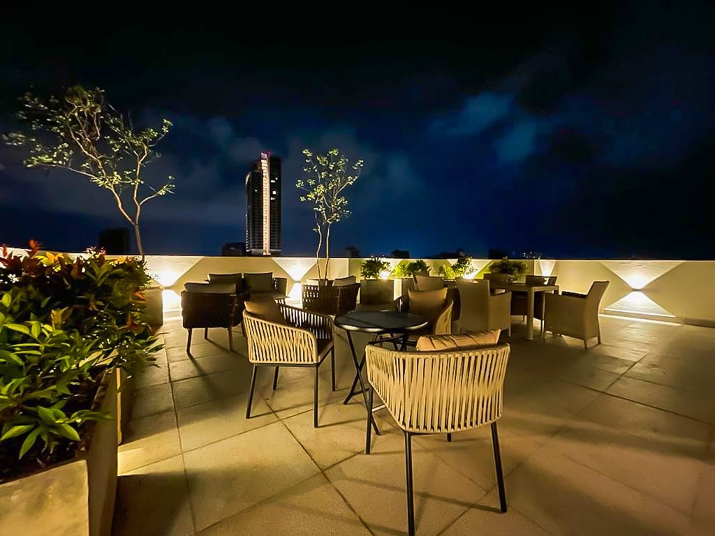 Rooftop terrace lounge with city skyline views at C7 Colombo